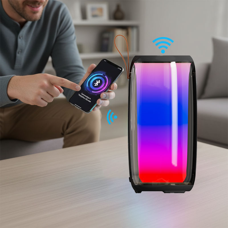 A person connecting their phone to a karaoke speaker via Bluetooth